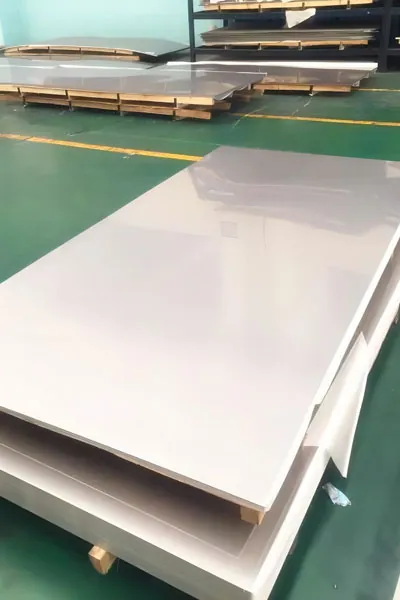 Stainless steel sheets and plates stacked in a warehouse